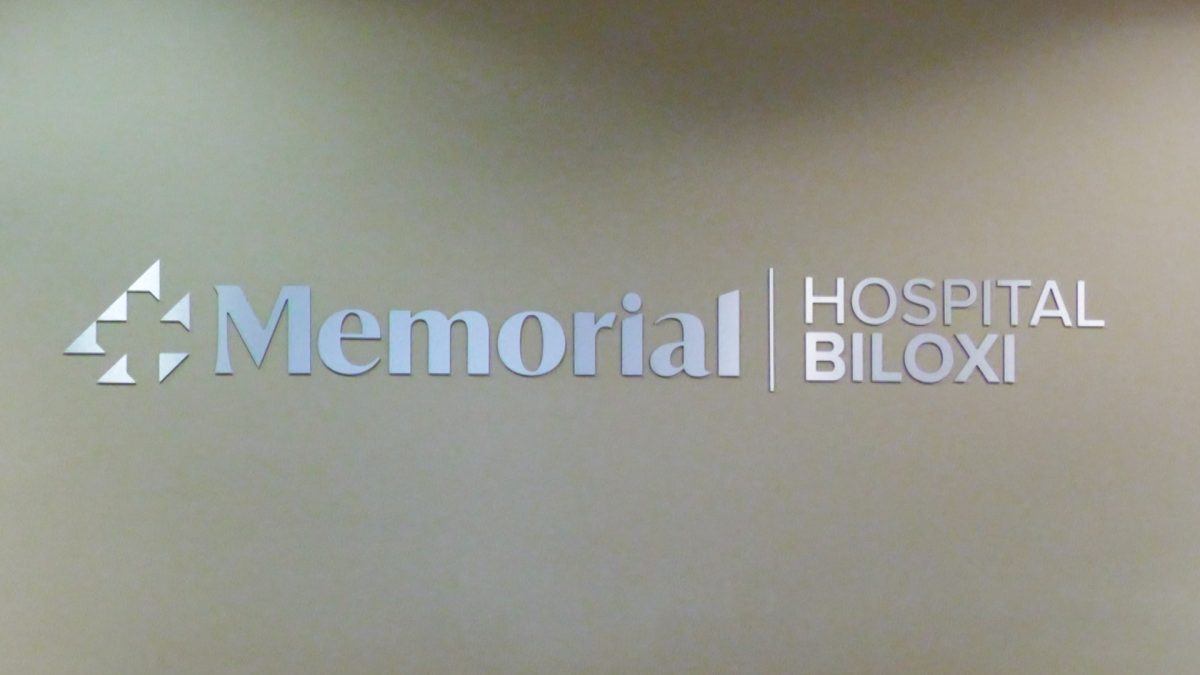 New signage indicates the transfer of ownership of Merit Health Biloxi to Memorial Health System.