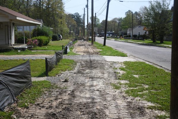A section of sidewalk along West 7thStreet remains torn up as crews continue utility line upgrades. Residents said the construction has created daily obstacles but welcome the long-term improvements. (RHCJC News)