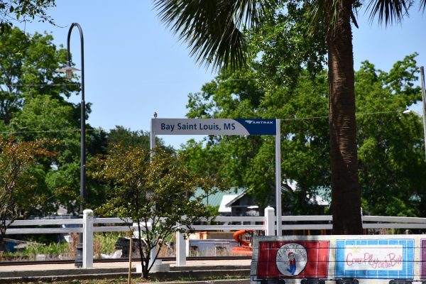 A sign along the platform in Bay St. Louis, Mississippi, marks the city’s readiness to receive Amtrak passengers as part of the new Mardi Gras route. The rail line will reconnect Gulf Coast communities with Mobile and New Orleans for the first time in nearly two decades.