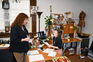 Director Sherri Marengo speaks with Hattiesburg Arts Council Arts Facilitator Mary Lucas Halliwell during a planning session inside the Hattiesburg Cultural Center. The Legacy Actors Theatre Experience performs regularly for church groups and senior living communities.