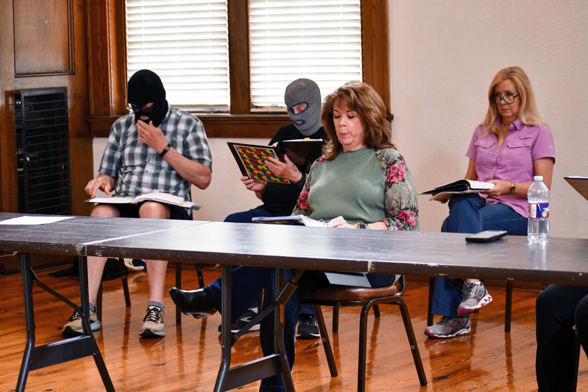 Legacy Actors Theatre members Eric Weill (masked), Steve Clyburn (masked), Karen Perkins Daniel and Regina Raybourn Lott rehearse a comedy sketch. The group blends humor and storytelling to engage audiences across the Pine Belt.