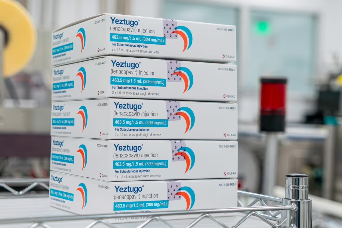 Stacked boxes of Yeztugo (Lenacapavir) HIV prevention injection on a metal shelf in a medical facility.