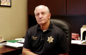 Forrest County Sheriff Charles Sims sitting in his office speaking with RHCJC News.