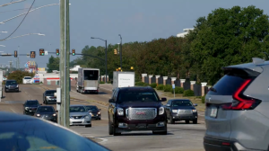Vehicles travel along Hardy Street in Hattiesburg on a clear day.
