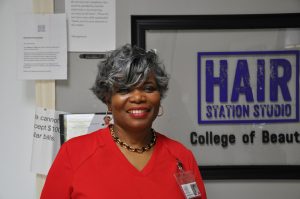 Sylvina Buckley stands inside Hair Station Studio College of Beauty in Petal.