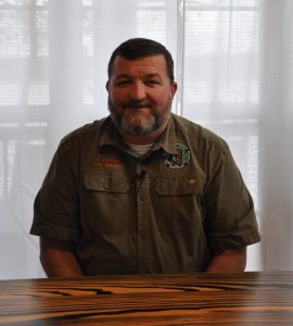Michael Clark, manager of Flint Creek Water Park, sits at a table during an interview.