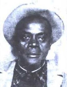 An antiquated headshot of a man in a lapelled coat and brimmed hat.