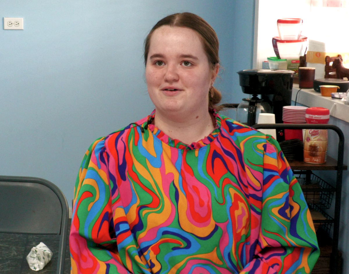 Zella Bush sits in a chair inside the Developing Family Resources building and discusses recovery efforts following the severe storms in May 2026.