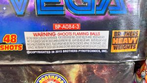 Close-up of a consumer fireworks package showing printed safety and handling instructions.