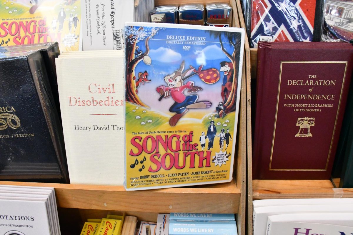 A DVD copy of Disney’s “Song of the South” is displayed for sale on a shelf at Beauvoir in Biloxi, alongside books and gift shop merchandise, including titles about American history and the Civil War.